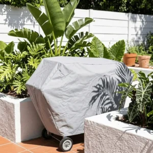 Grey heavy duty braai canvas cover fitted over a mobile grill unit.